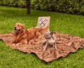 golden retriever and french bulldog sharing sable tan throw blanket