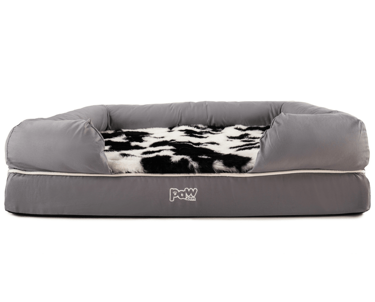 black faux cowhide topper on bolster bed