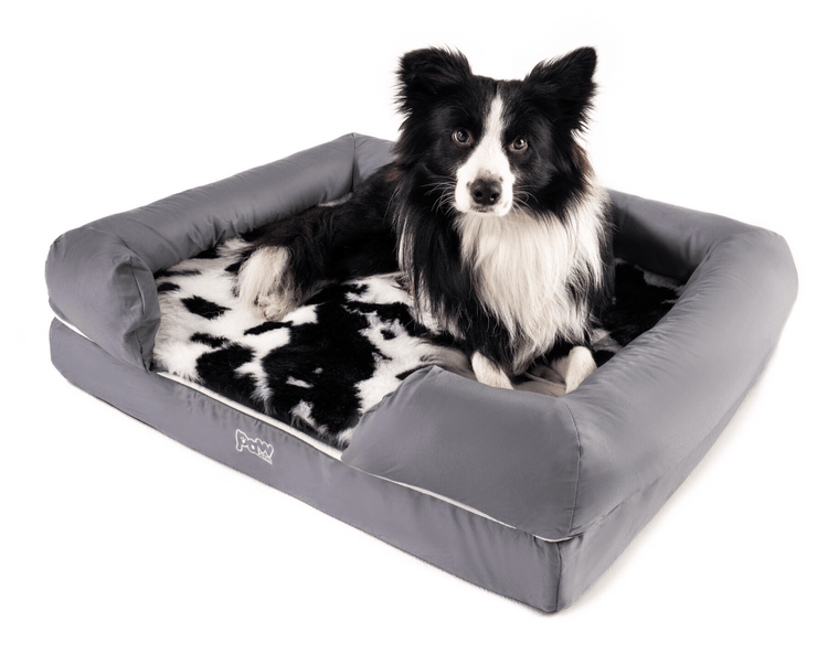 black faux cowhide topper on bolster bed