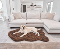 labrador retriever dog on brown faux fur pet bed