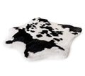 black and white faux cowhide bed cover on white background